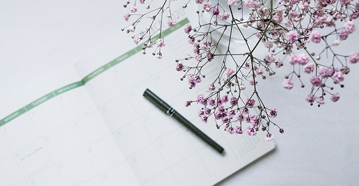 Pen and flowers on a table