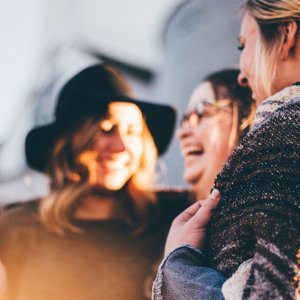 Group of three women laughing