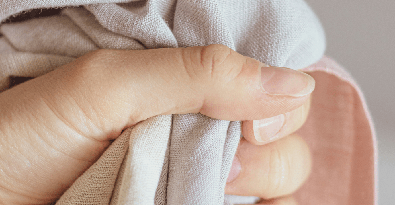 Woman's hand holding a cloth